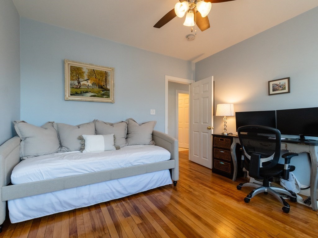 31-33 College Hill Road Somerville, MA 02144 - Photo 11 of 38 a bedroom with a bed and a flat screen tv