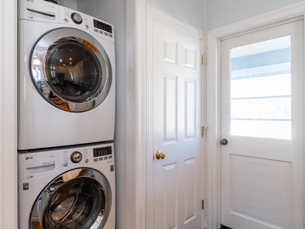 31-33 College Hill Road Somerville, MA 02144 - Photo 15 of 38 a view of a hallway with washer and dryer