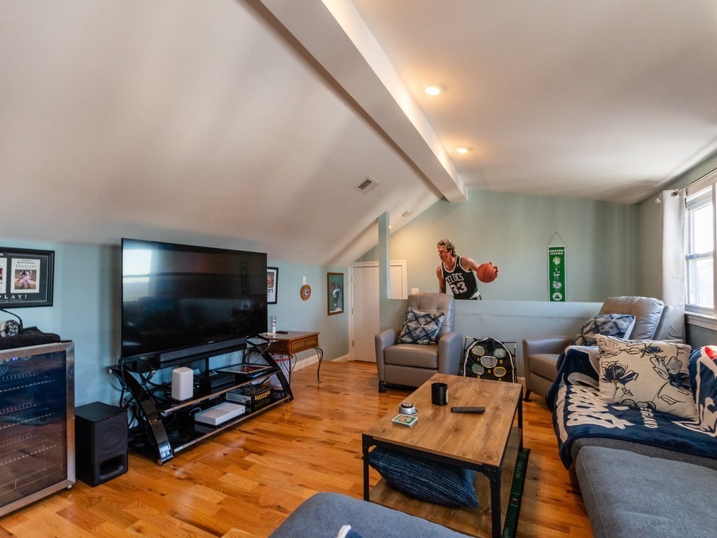 31-33 College Hill Road Somerville, MA 02144 - Photo 19 of 38 a living room with furniture and a flat screen tv