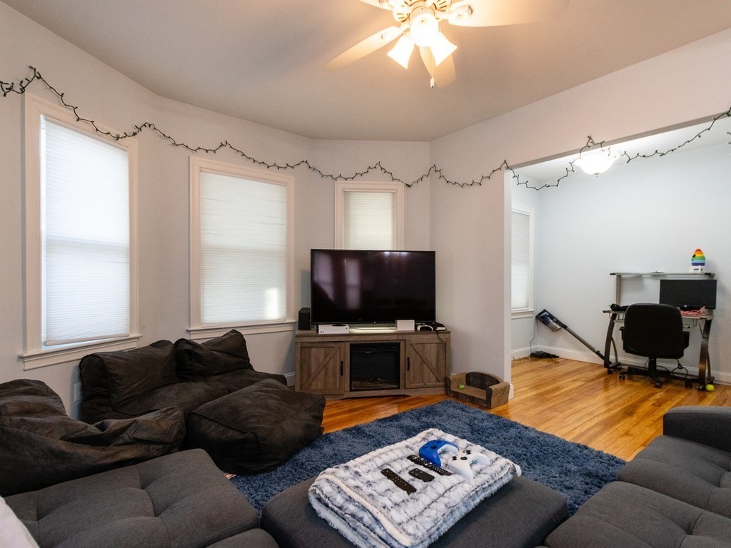 31-33 College Hill Road Somerville, MA 02144 - Photo 20 of 38 a living room with furniture and a flat screen tv