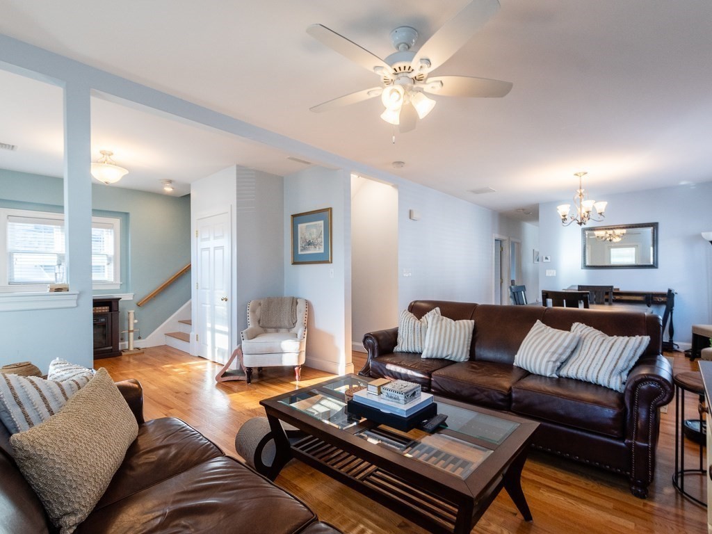 31-33 College Hill Road Somerville, MA 02144 - Photo 2 of 38 a living room with furniture and a lamp