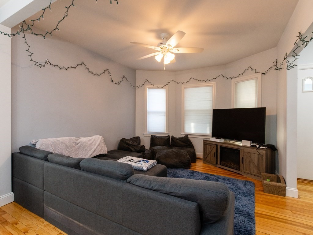 31-33 College Hill Road Somerville, MA 02144 - Photo 21 of 38 a living room with furniture and a flat screen tv