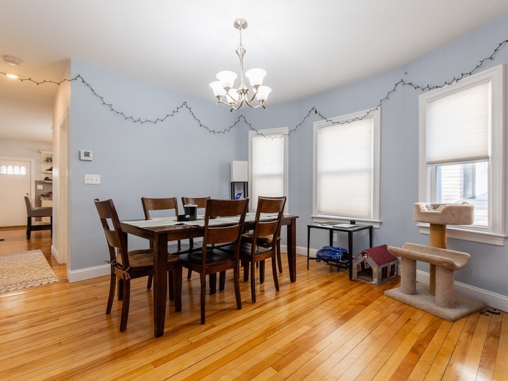 31-33 College Hill Road Somerville, MA 02144 - Photo 22 of 38 a view of a dining room with furniture and wooden floor