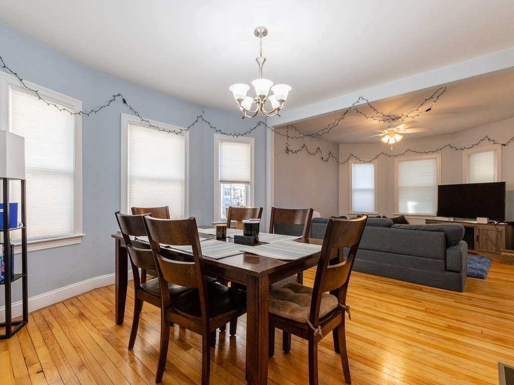 31-33 College Hill Road Somerville, MA 02144 - Photo 23 of 38 a view of a dining room with furniture and wooden floor