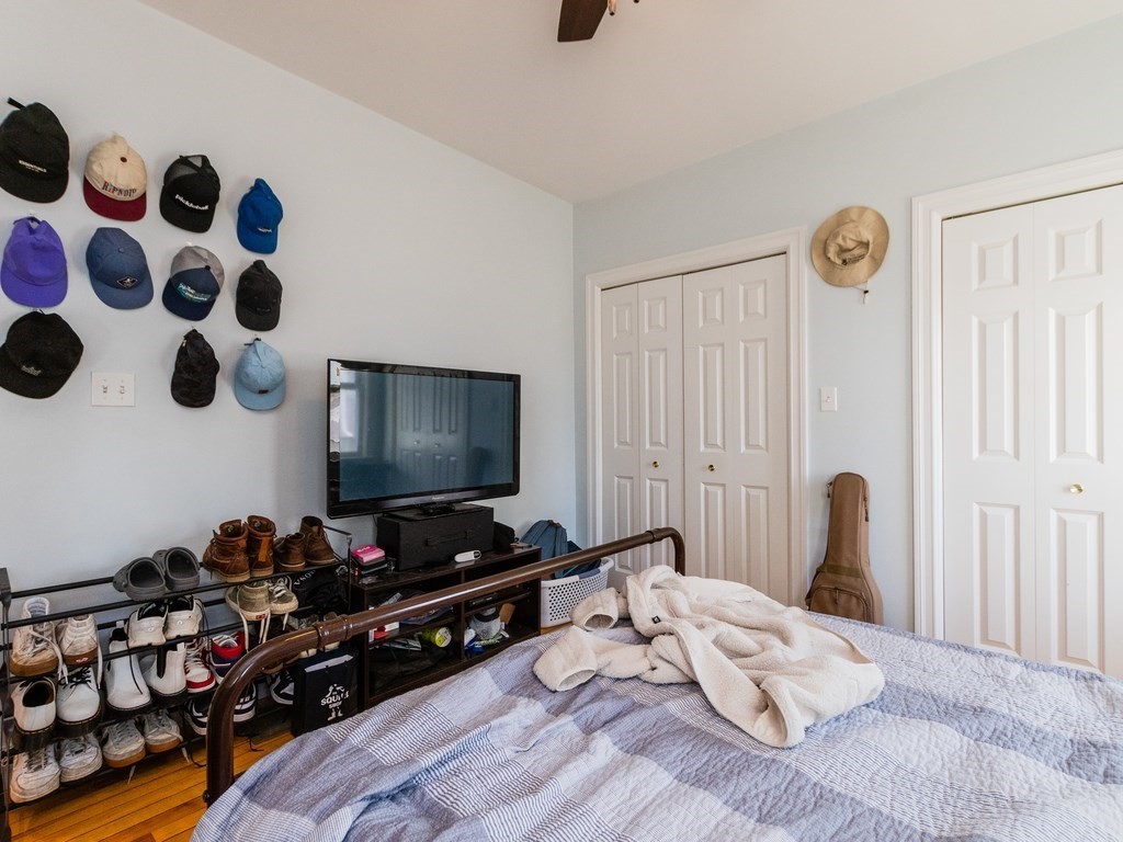 31-33 College Hill Road Somerville, MA 02144 - Photo 28 of 38 a bedroom with bed and a window