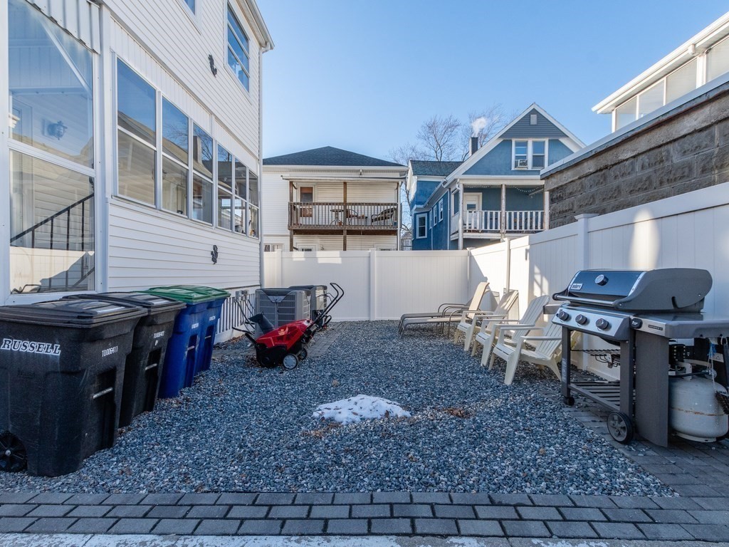31-33 College Hill Road Somerville, MA 02144 - Photo 34 of 38 a view of a house with backyard and sitting area