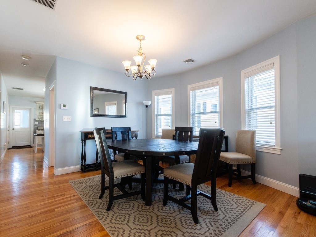 31-33 College Hill Road Somerville, MA 02144 - Photo 5 of 38 a view of a dining room with furniture and wooden floor