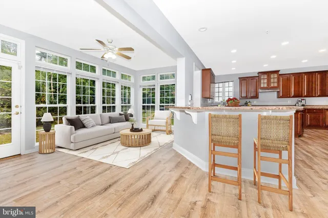 a view of a kitchen with granite countertop a oven and a large window