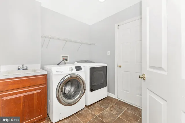 a view of staircase with lots of wooden floor and windows
