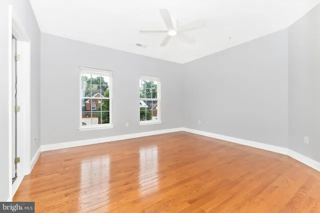 a white toilet sitting next to a bath tub