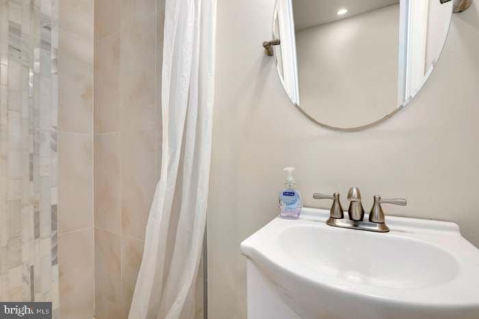 1720 H Street Northeast, Unit A Washington, DC 20002 - Photo 24 of 31 Sleek bathroom with modern elegance.