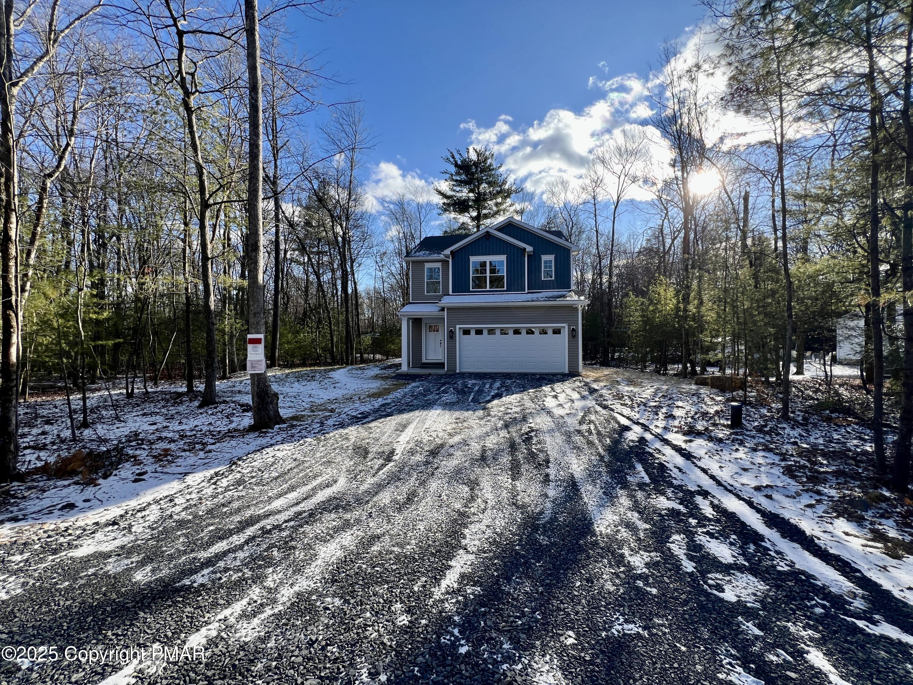 253 Hawthorn Lane Kunkletown, PA 18058 - Photo 2 of 39 a front view of a house with a yard and tree s