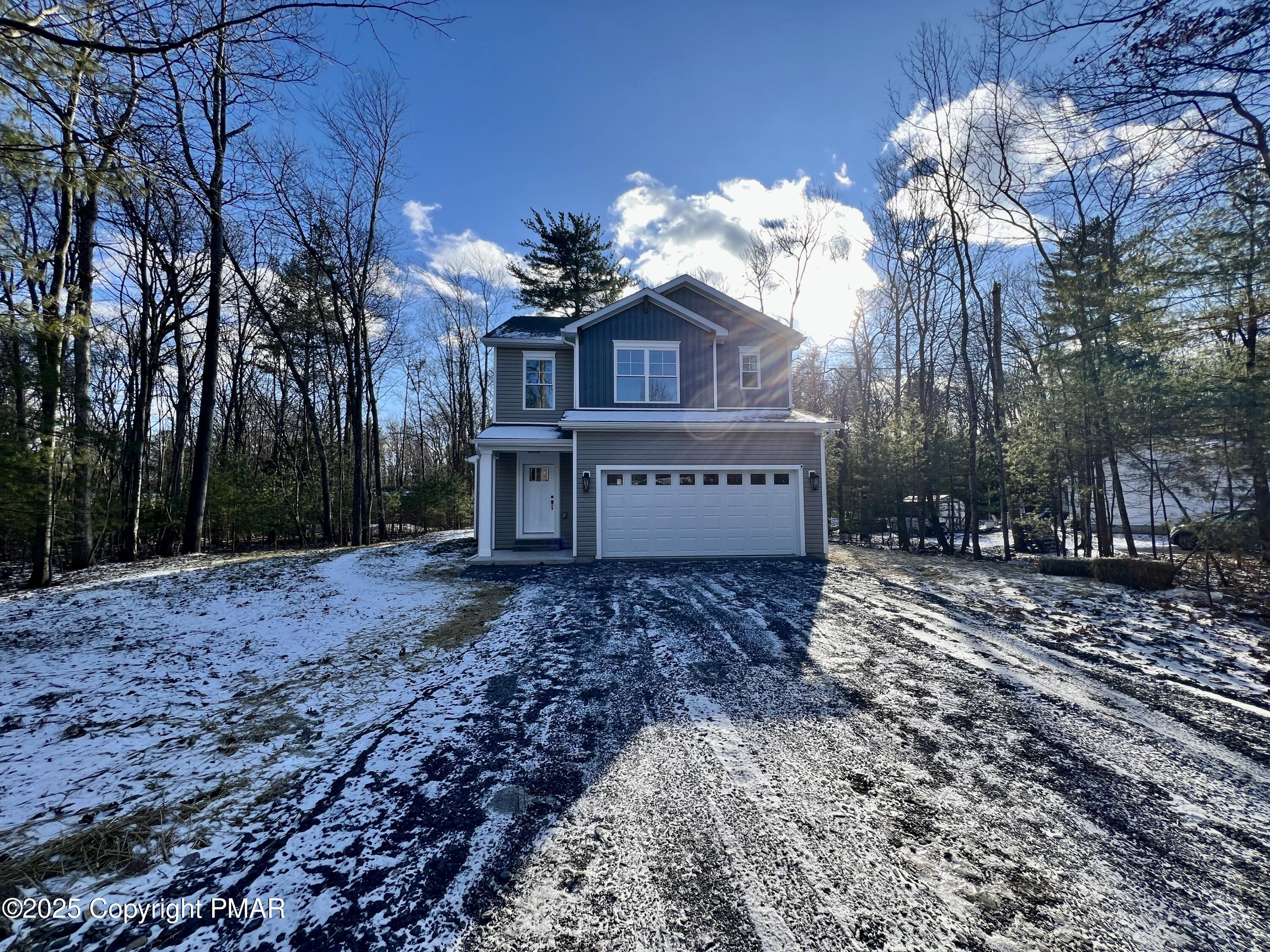 253 Hawthorn Lane Kunkletown, PA 18058 - Photo 3 of 39 a view of a house with a yard covered with snow