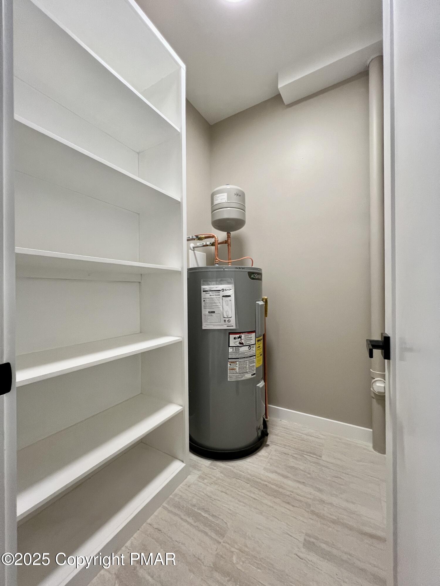 253 Hawthorn Lane Kunkletown, PA 18058 - Photo 35 of 39 a view of a refrigerator in kitchen and an empty room