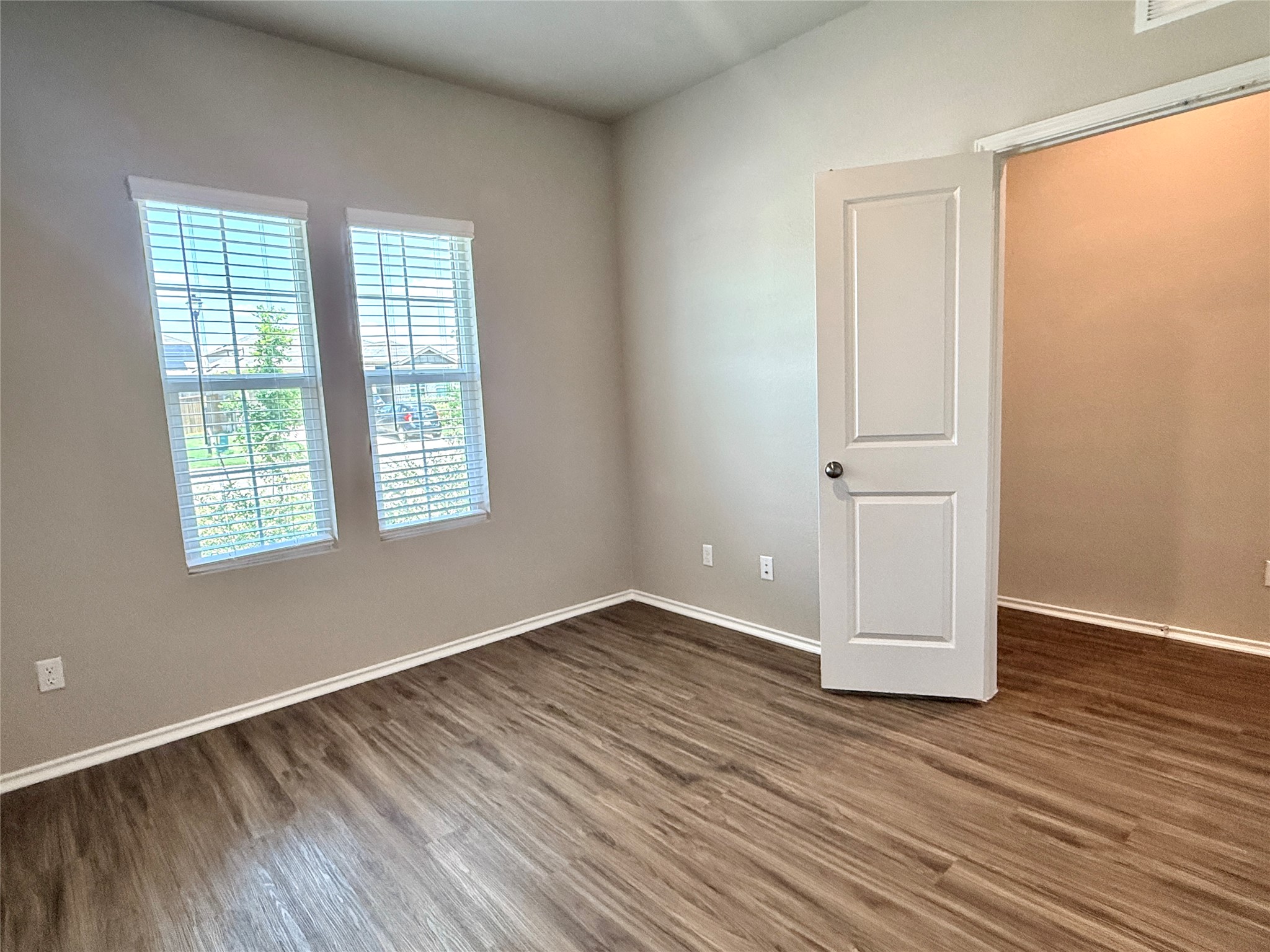 129 Perfect World Loop Jarrell, TX 76537 - Photo 5 of 31 Laminate flooring adds warmth and durability to this versatile space.