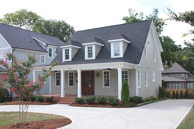 508 Mial Street Raleigh, NC 27608 - Photo 2 of 25 The home features a circular driveway plus a long driveway that leads to a huge parking pad area outside the fenced yard. Beautiful landscaping accents the drive and yard. Front