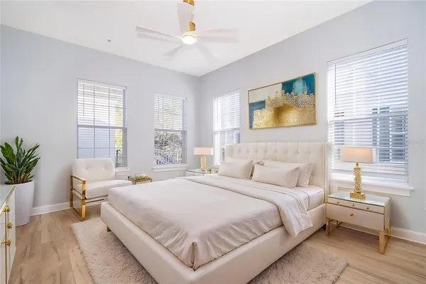 a bedroom with a large bed and a window