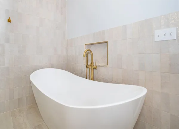 a white tub sitting in a bathroom
