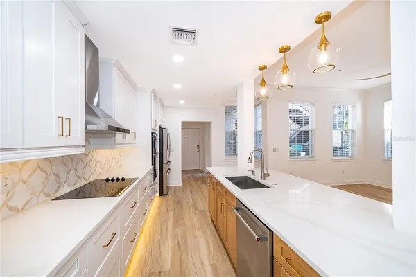 a spacious bathroom with a double vanity sink and a large mirror