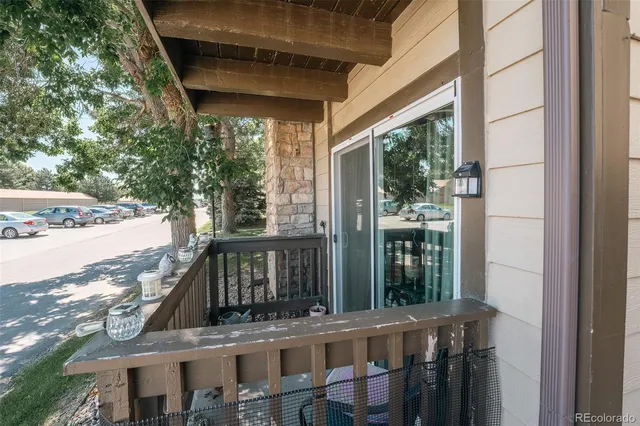 a view of a balcony with wooden floor and outdoor space