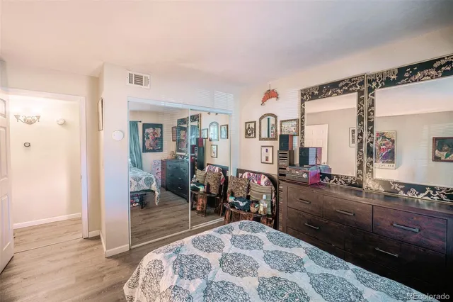 a living room with furniture rug and a table