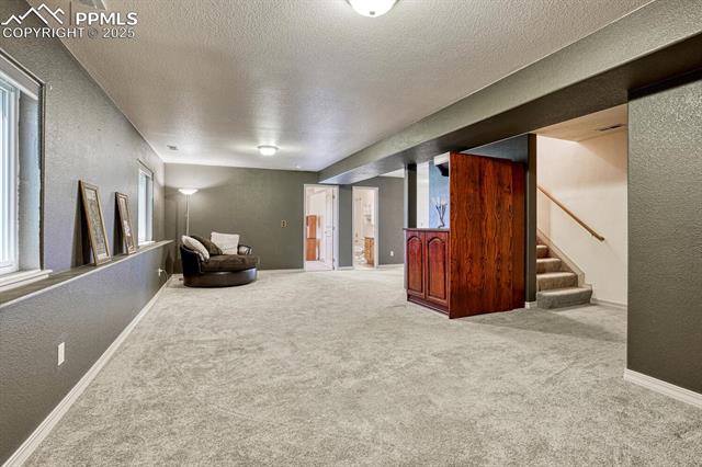 11455 Dallas Road Peyton, CO 80831 - Photo 43 of 50 Garden Level Recreation Room with neutral carpet.