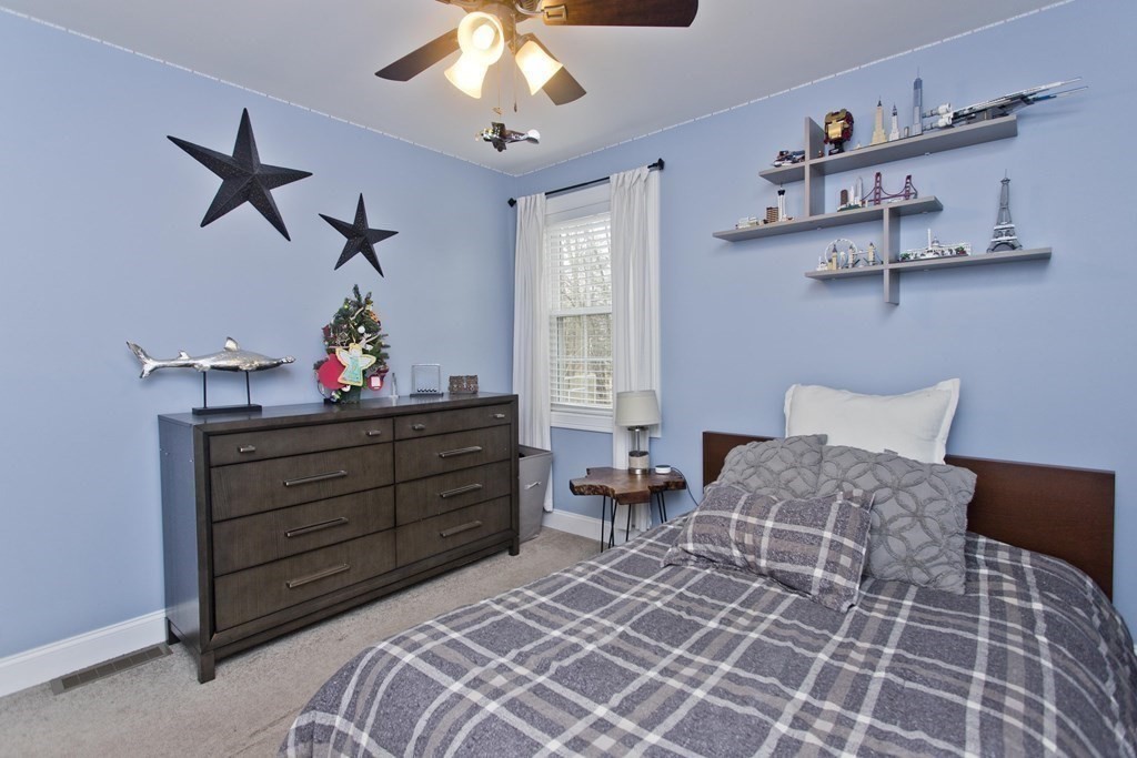 19 Valley Road Southampton, MA 01073 - Photo 19 of 32 a bed room with a bed and a chandelier