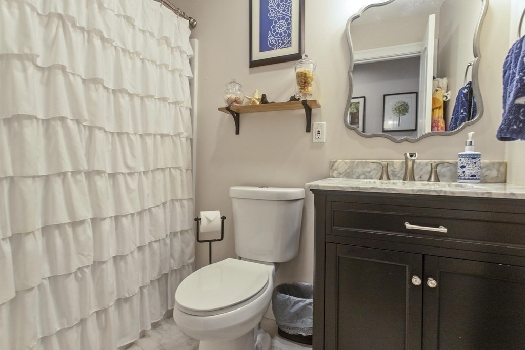 19 Valley Road Southampton, MA 01073 - Photo 24 of 32 a bathroom with a granite countertop toilet sink and a mirror
