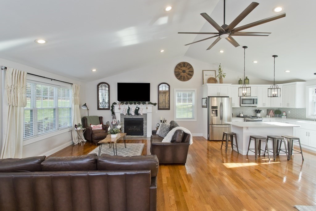 19 Valley Road Southampton, MA 01073 - Photo 4 of 32 a living room with furniture a flat screen tv and a fireplace