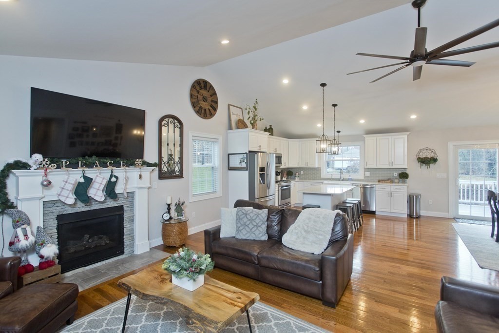 19 Valley Road Southampton, MA 01073 - Photo 7 of 32 a living room with furniture a flat screen tv and a fireplace
