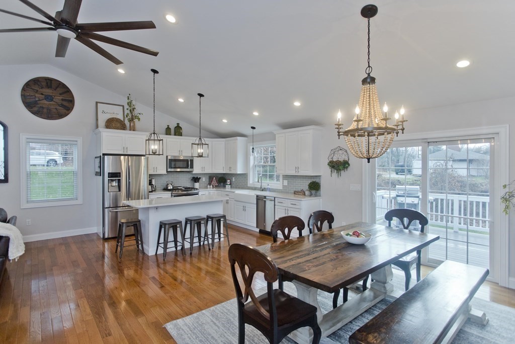 19 Valley Road Southampton, MA 01073 - Photo 8 of 32 a kitchen with stainless steel appliances granite countertop a dining table chairs and stove