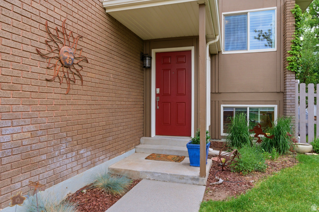 3674 Oak Rim Way Salt Lake City, UT 84109 - Photo 4 of 47 Red paneled entry door with an overhead porch light