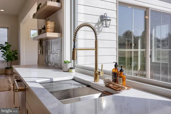 a kitchen with a sink and a refrigerator
