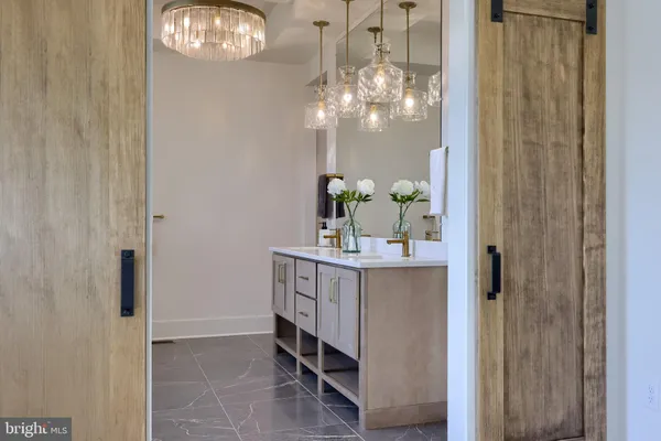 a bathroom with a mirror and a sink