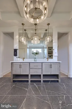 a room with painting and a chandelier