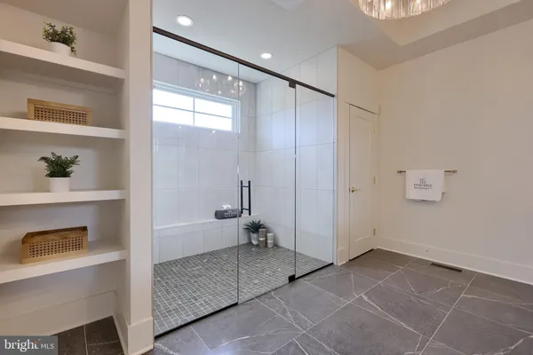 a bathroom with a shower and a sink