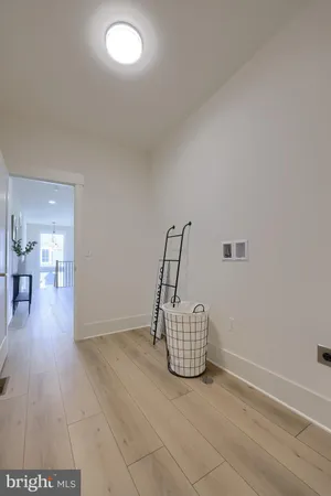 a view of an empty room and wooden floor