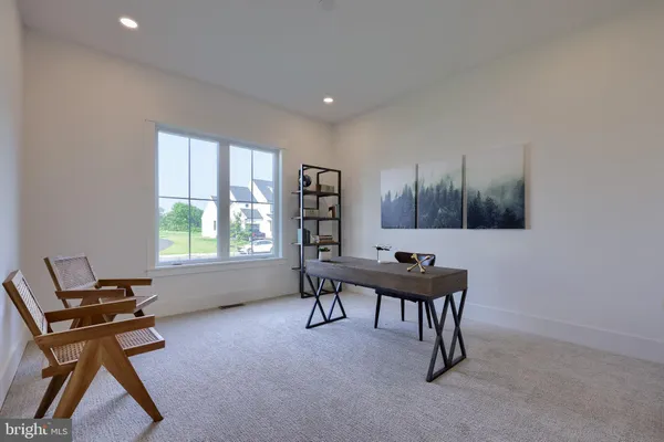 a room that has a bed and a chair in it