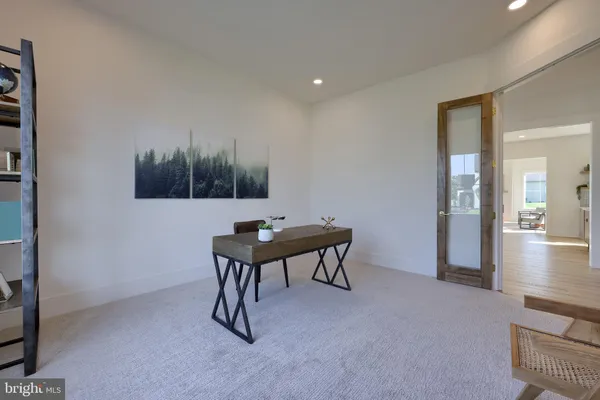 a view of a room with furniture and wooden floor