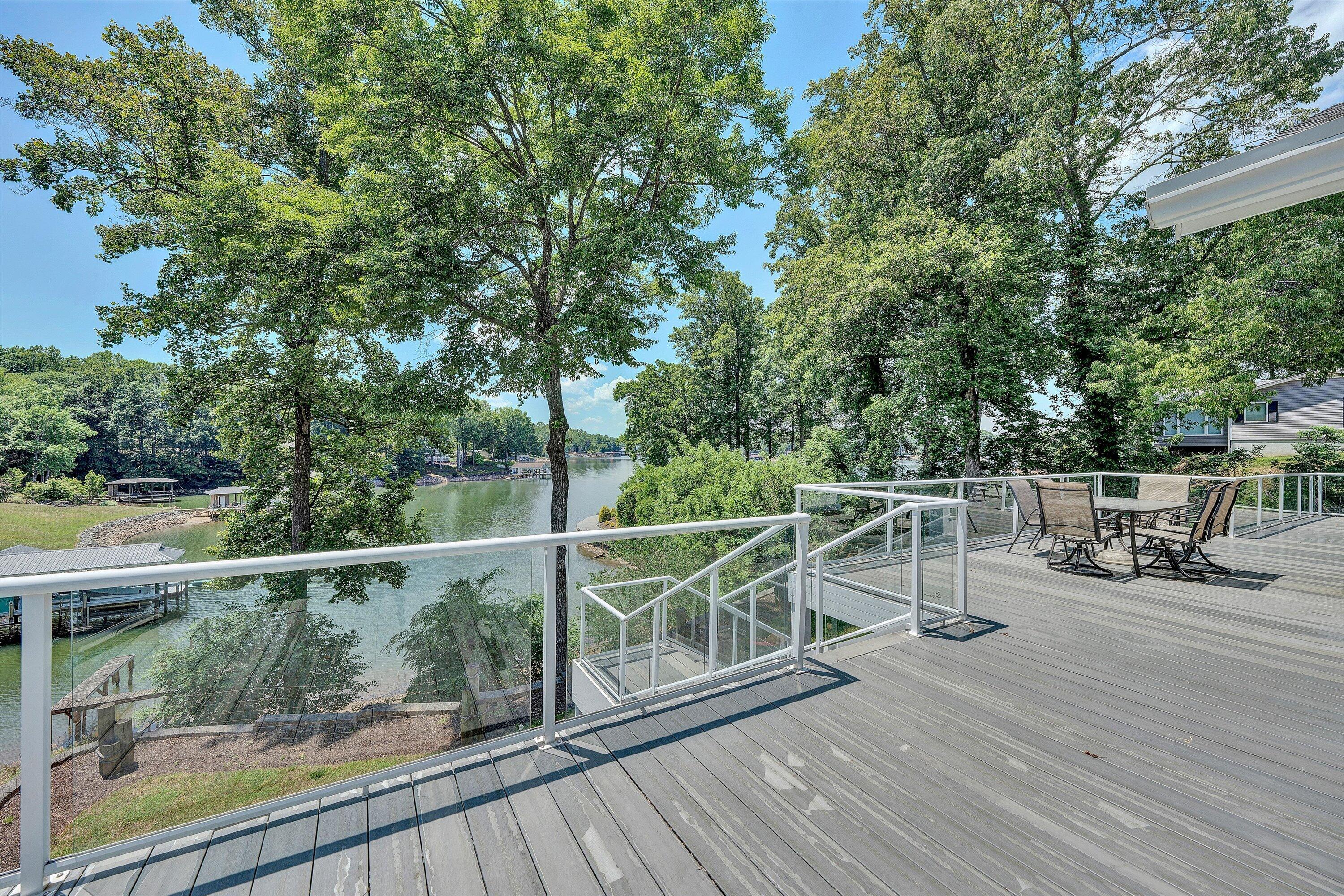 207 Winding Way Union Hall, VA 24176 - Photo 17 of 60 a view of a balcony with chairs and wooden fence