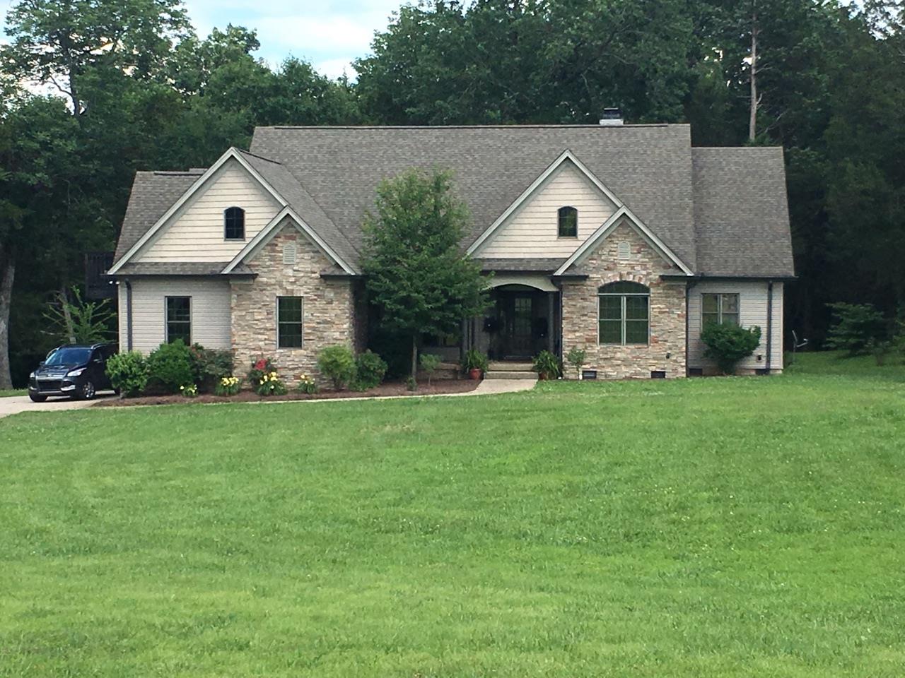 471 Ligon Road Lebanon, TN 37090 - Photo 1 of 18 a house with a big yard and large trees