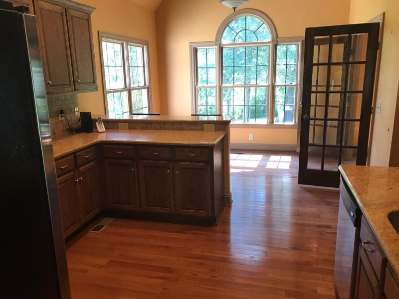 471 Ligon Road Lebanon, TN 37090 - Photo 9 of 18 a kitchen with stainless steel appliances granite countertop a stove a sink and a large window