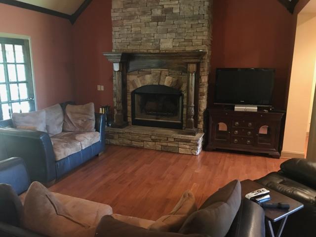 471 Ligon Road Lebanon, TN 37090 - Photo 10 of 18 a living room with furniture and a fireplace