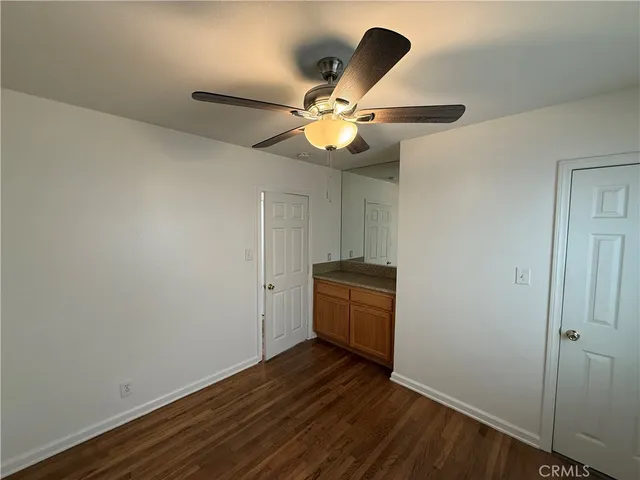 a view of room with wooden floor