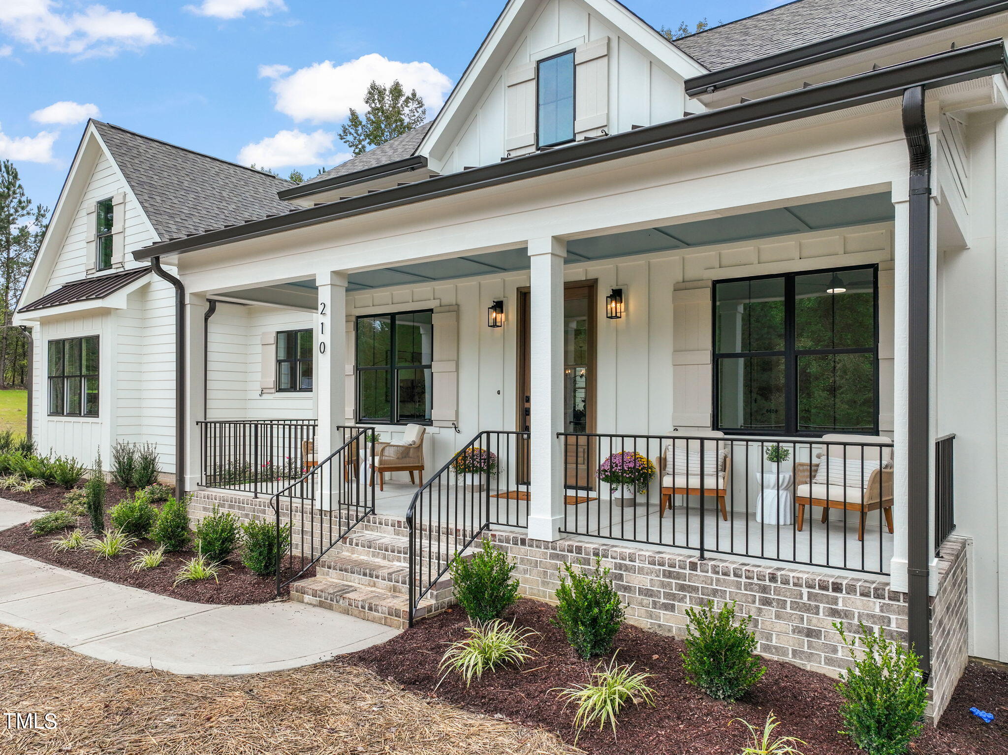210 Pilot Ridge Road Zebulon, NC 27597 - Photo 2 of 46 a view of a house with a small porch