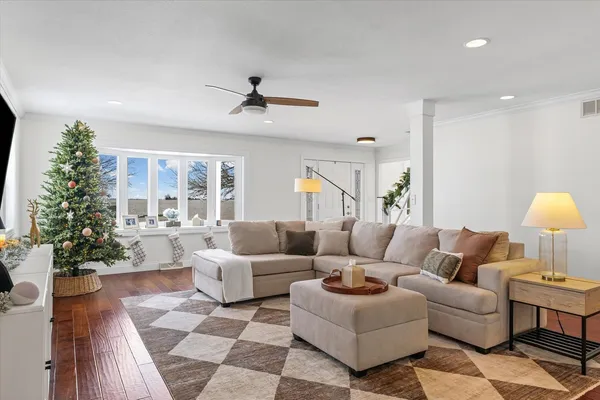 a living room with furniture and a large window