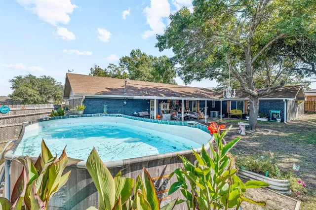 a front view of house with yard outdoor seating and barbeque oven