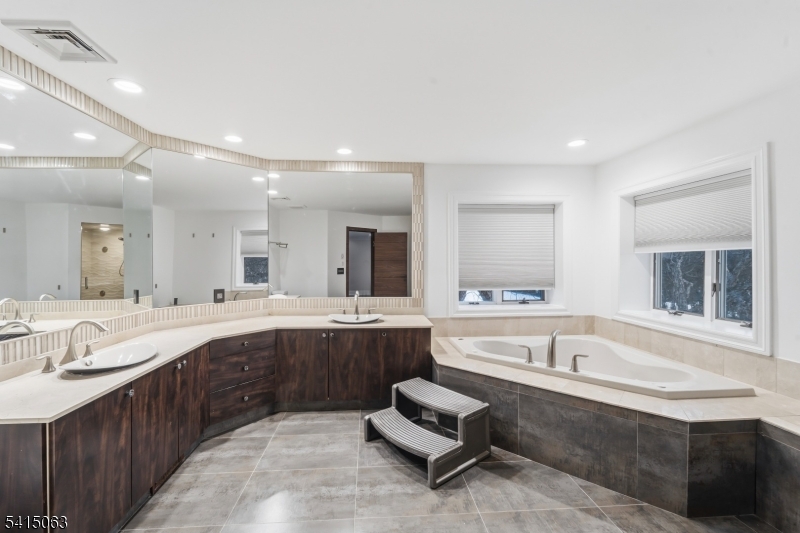 99 Ogle Road Old Tappan, NJ 07675 - Photo 20 of 35 a large bathroom with a large tub and sink