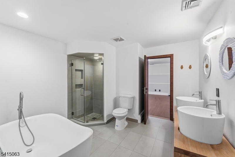 99 Ogle Road Old Tappan, NJ 07675 - Photo 23 of 35 a bathroom with a toilet sink and shower