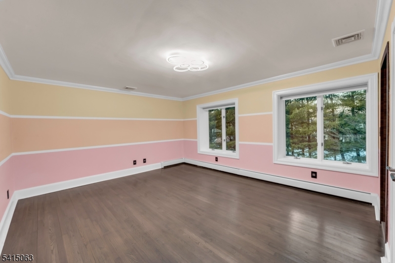 99 Ogle Road Old Tappan, NJ 07675 - Photo 24 of 35 a view of room with window and wooden floor